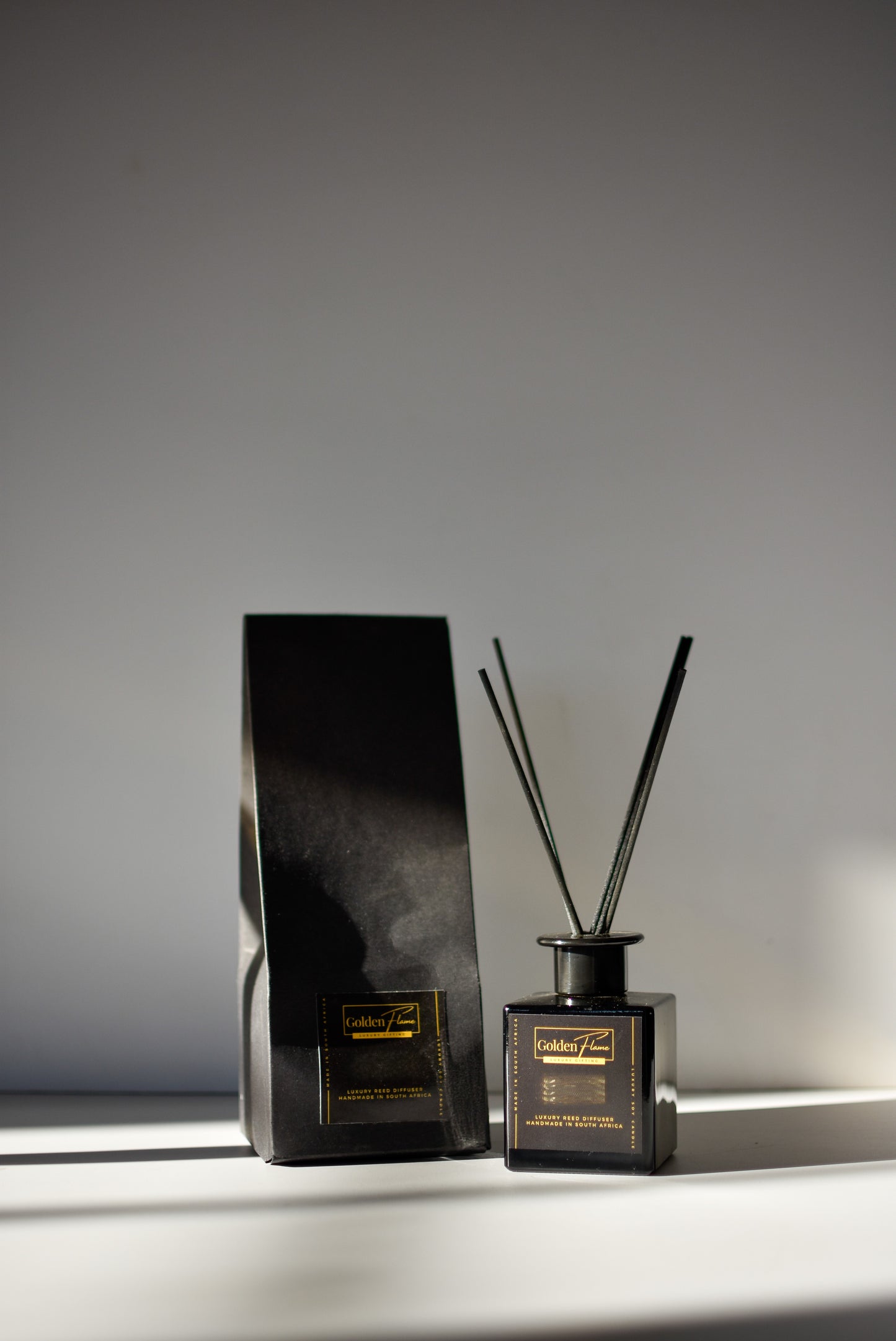 Pomegranate & Sage Reed Diffuser in black glass bottle