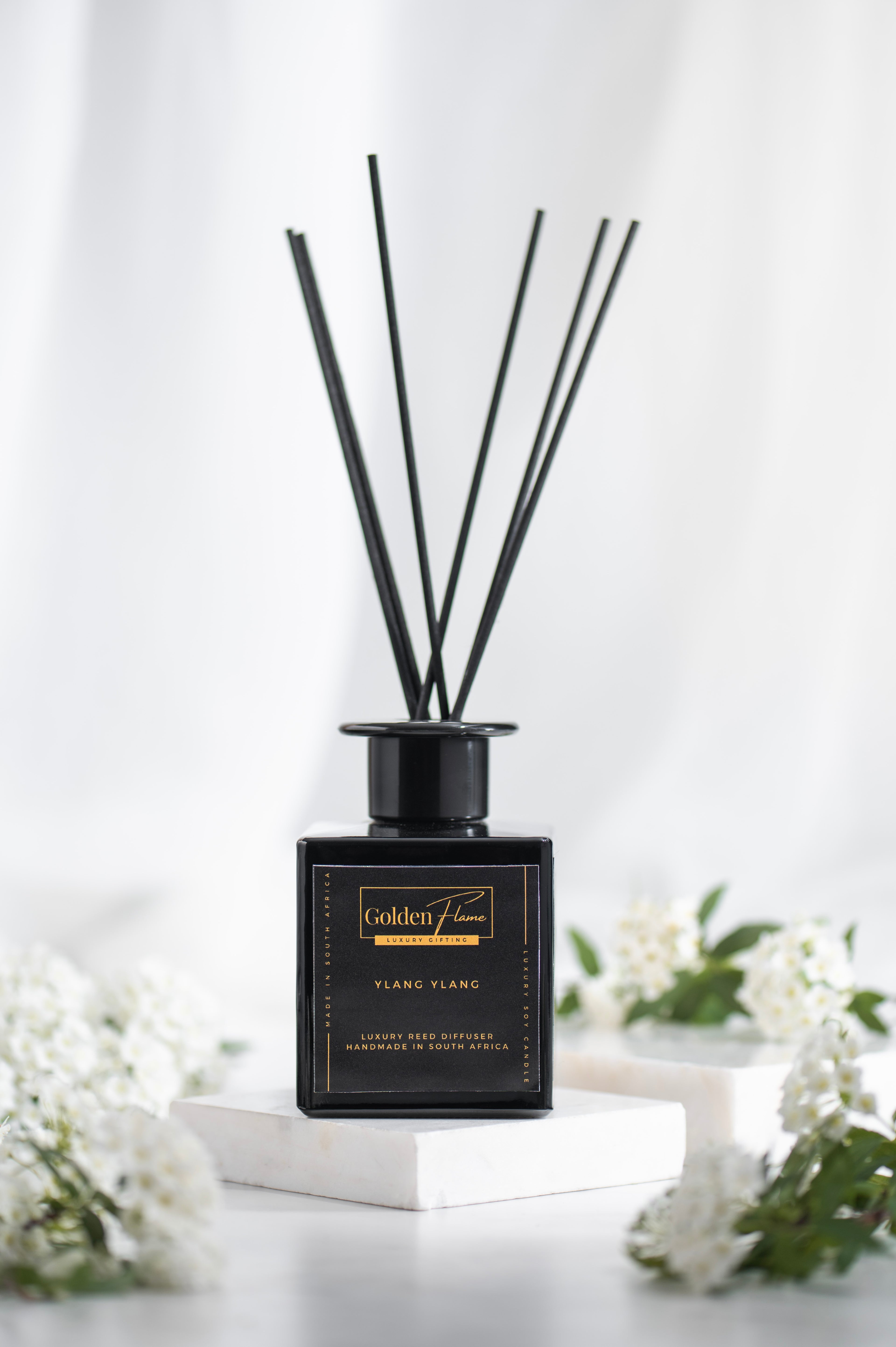 Diffuser with black sticks on a white background